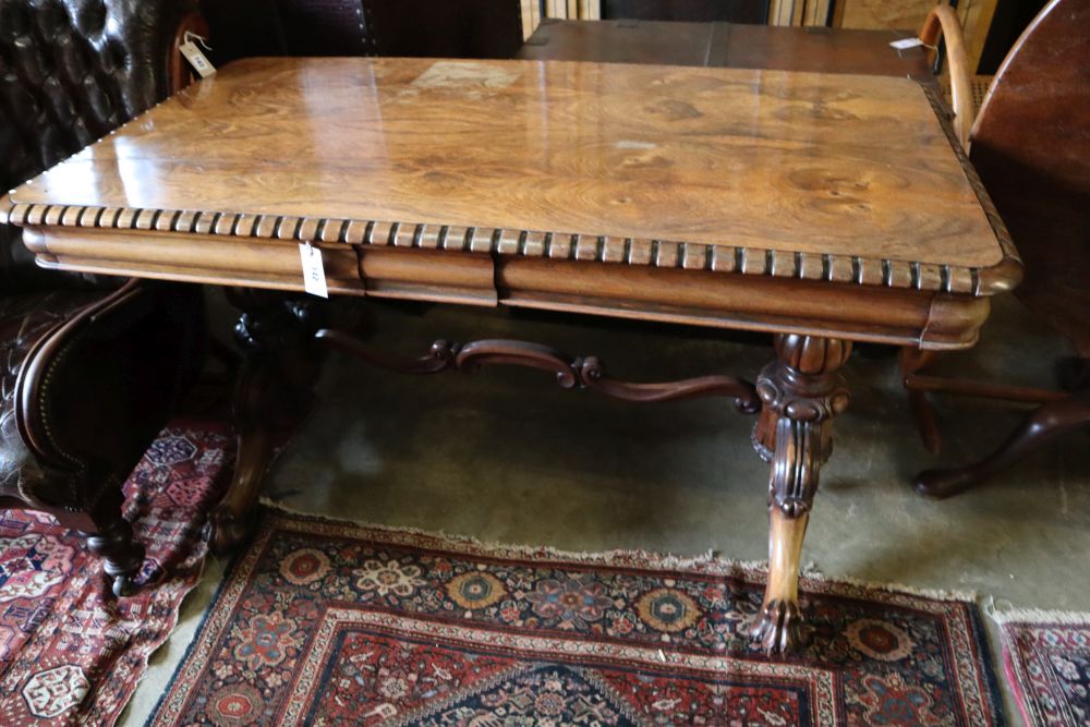 A William IV rosewood centre table, the top with rounded corners and dentil-moulded edge, on lions paw feet, width 136cm depth 70cm